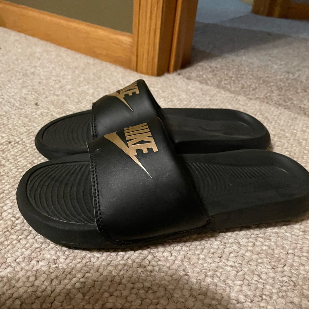 Nike Black and Gold Slides